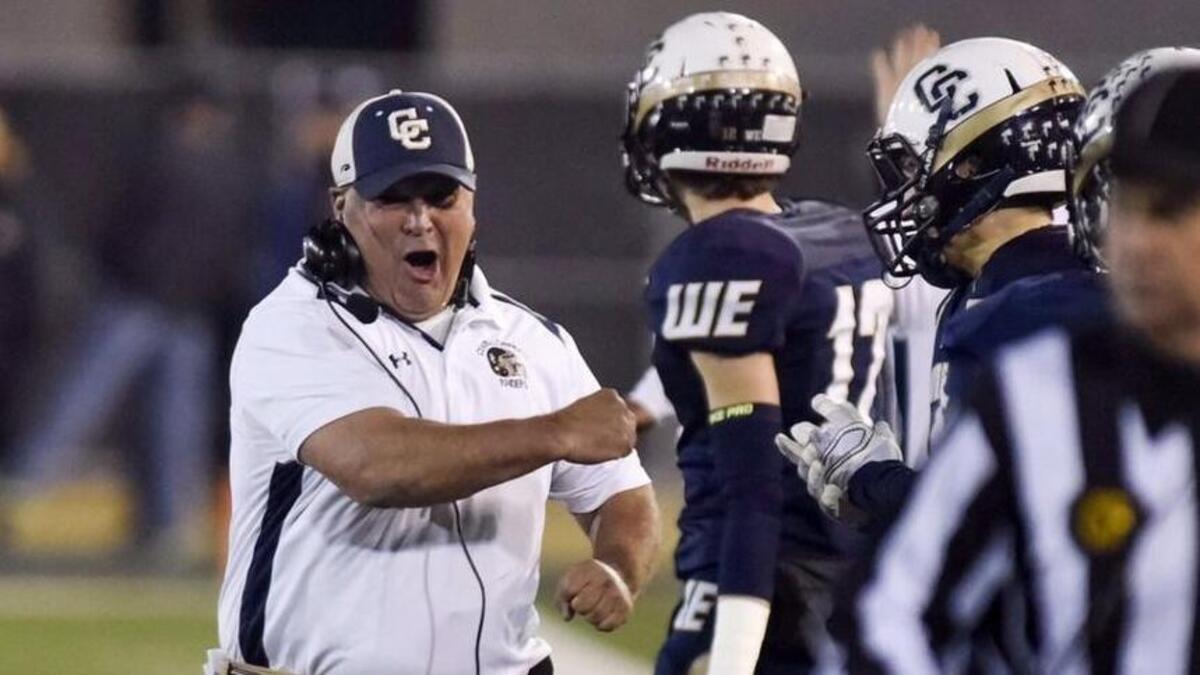 Central Catholic coach Roger Canepa pumps his fist after a interception and touchdown during the CIF Open Division Small School championship against San Marino at Sacramento State on Dec. 19, 2015.
