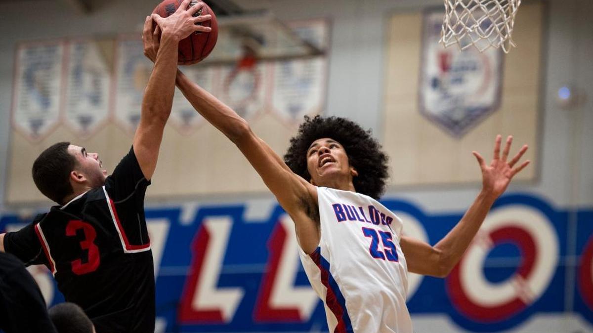 Folsom senior center Mason Forbes (25) snatches a rebound from Lincoln guard Sam Smith on Nov. 27, 2017 at Folsom High School. Forbes committed to play basketball on scholarship at Harvard.