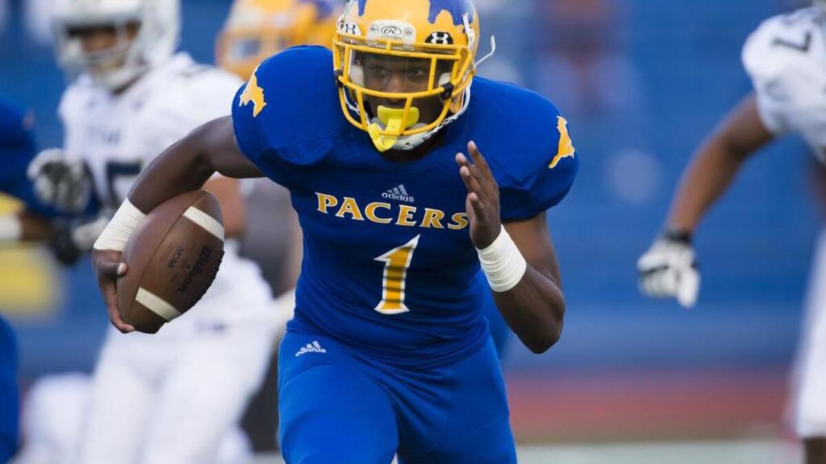 
Grant’s Michael Green (1), runs with the ball as the Grant High School Pacers host the Burbank High School Titans in their football match on Friday, August 28, 2015.
