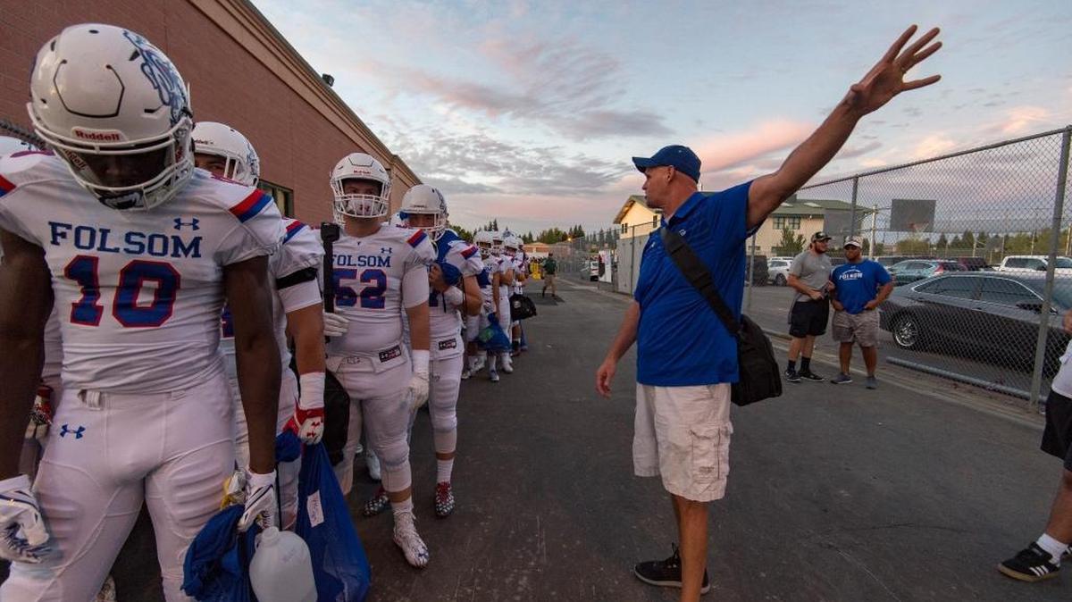 Folsom coach Kris Richardson talks to his team before facing Granite Bay on Sept. 29.