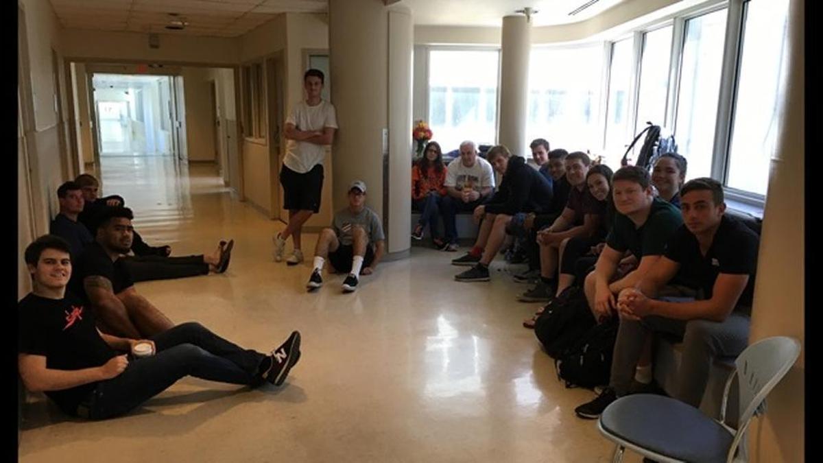 The Cal rugby team visits the Santa Clara Valley Medical Center in solidarity with Robert Paylor, who was paralyzed in the national rugby championship on Saturday.