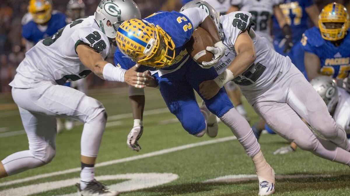 Pacers Jalyn Norris (22) carries the ball during the game between the Grant Pacers and the Granite Bay Grizzlies at Grant High School in Sacramento on Friday, November 11, 2016.