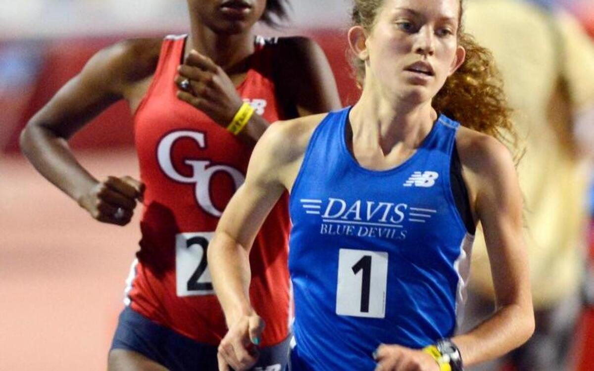 Davis High School’s Fiona O’Keeffe leads Golden Oak’s Destiny Collins in the early laps of the girls 3,200-meter run at the CIF State Track & Field Championships at Buchanan High School’s Veterans Memorial Stadium in Clovis, Calif., on Saturday, June 6, 2015.