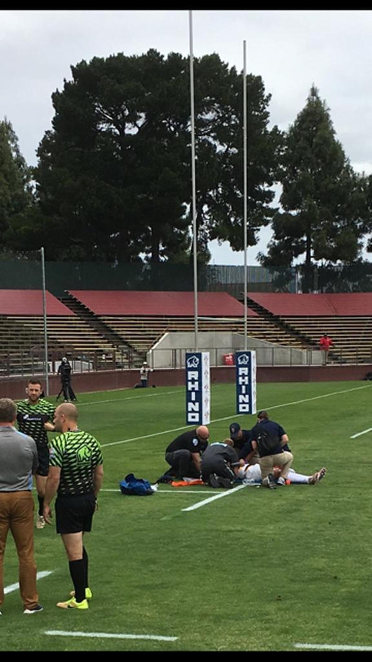 Cal rugby player Robert Paylor is attended to after suffering an injury during a match in Santa Clara.