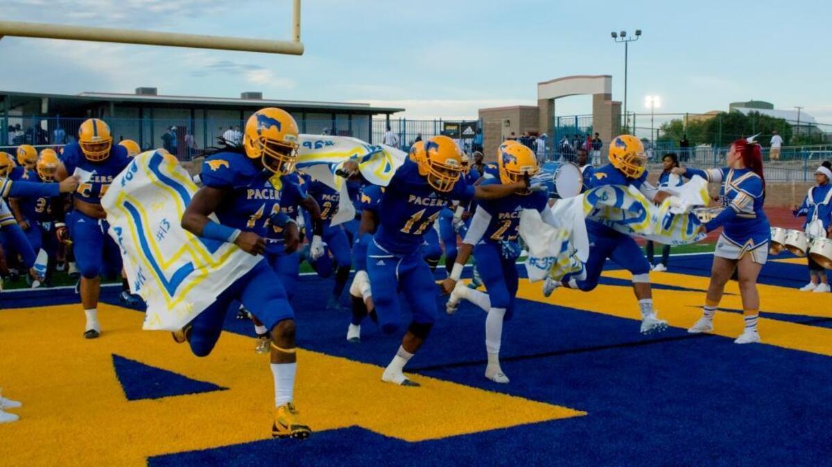 
Grant High players take their field for their season opener against Burbank on Friday August 28, 2015. 
