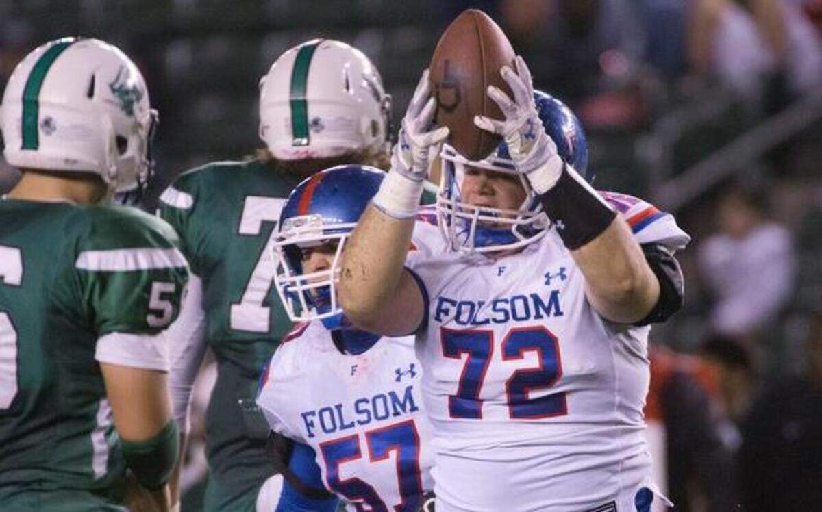 Folsom’s Austin Rothrock shows everyone he has the ball after recovering a fumble that set up the go-ahead touchdown.