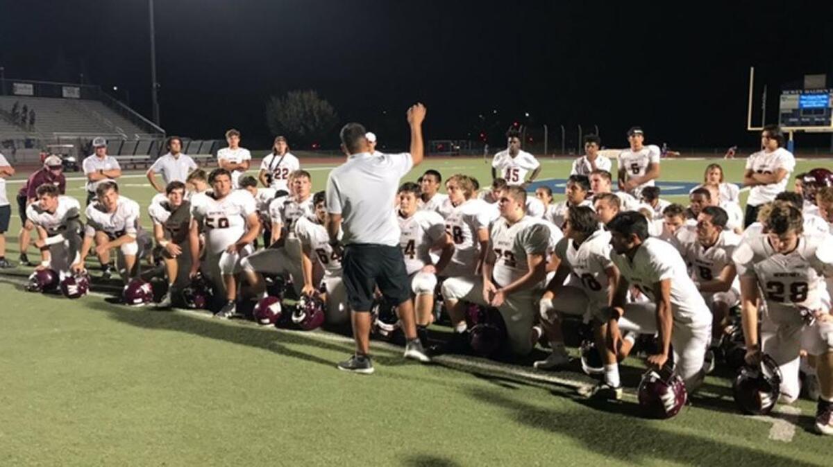 Interim coach Jesse Armas addresses the Whitney Wildcats after defeating Davis on Friday night.