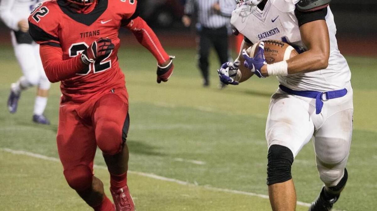 Running back Tariq Hollandsworth, carrying the ball against Burbank last November , and Sacramento High will visit the No. 19 Titans on Saturday at 1 p.m.