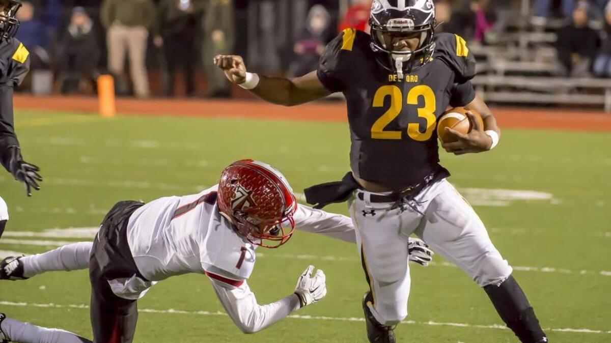Del Oro Golden Eagles Camrion Davis (23), runs with the ball during the first quarter as Del Oro hosts Antelope in the Sac-Joaquin Section Division II playoff game, Friday, November 25, 2016.