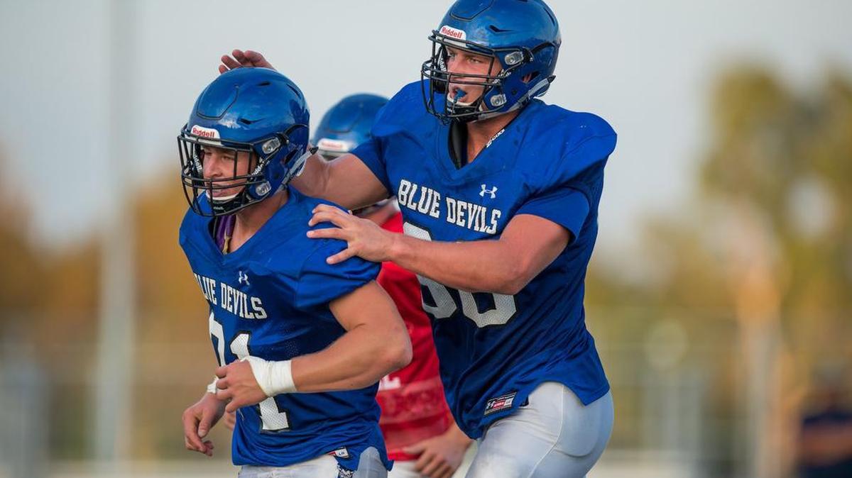 Davis High School defensive lineman and tight end Tucker Fisk (88) celebrates with a teammate during a pre-season scrimmage against Sacramento High School at Davis High School on Thursday, Aug. 27, 2015, in Davis, Calif.