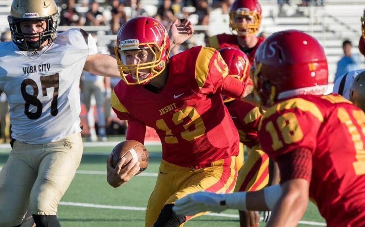 
Marauders' Calvin Brownholtz (13) dodges the Yuba City defense.
