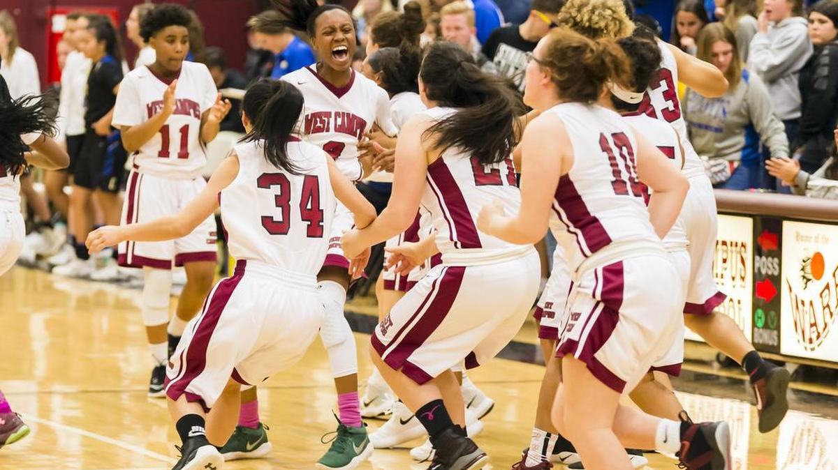 The West Campus Warriors react to their 59-54 win over Clovis.