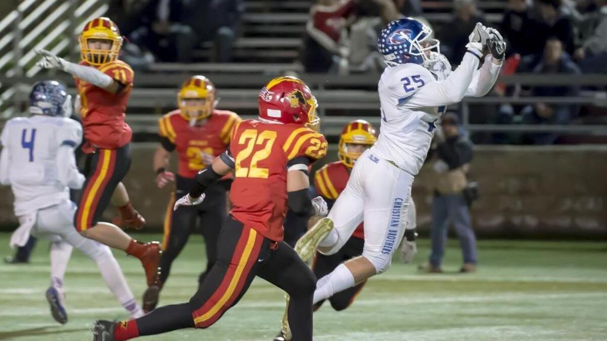 Christian Brothers High School Falcons Jack O'Hearn (25), just misses a catch during the second quarter as the Christian Brothers High School Falcons face the Oakdale Mustangs in the Sac-Joaquin Section Division III championship football game at Lincoln High School in Stockton, Friday Dec. 2, 2016.