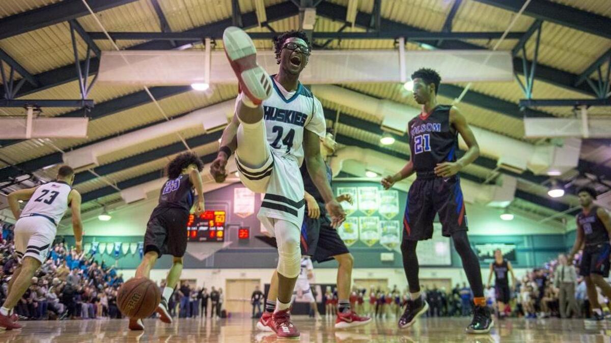 Sheldon Huskies forward Ronald Agebsar (24) yells after taking a pass and dunking the ball to give the Huskies a 64-60 lead on Wednesday in a Sac-Joaquin Section Division I semifinal.