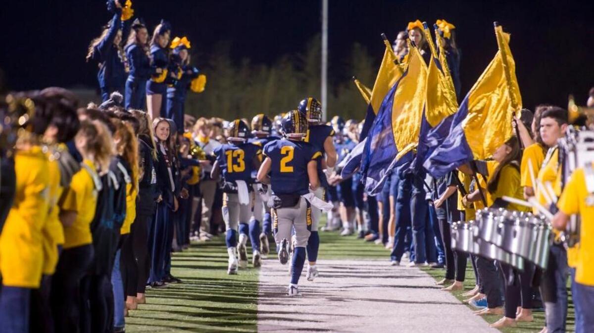 FILE - The Oak Ridge Trojans come on the to the field before the game as the Oak Ridge Trojans football team host the Folsom Bulldogs, Friday, Nov. 3, 2017. Oak Ridge defeated Gregori 49-17 Friday, Nov. 17, 2017 in El Dorado Hills.