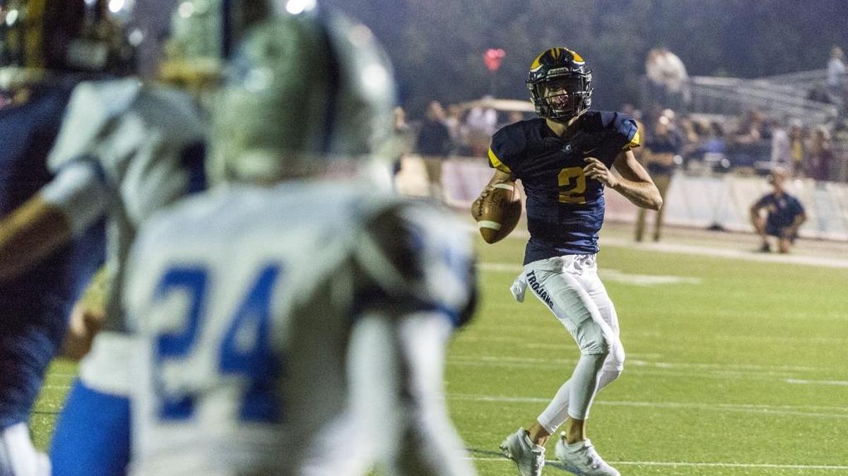 FILE - Oak Ridge Trojans Marco Baldacchino (2), looks to pass the ball as the Oak Ridge High School Trojans football team host the Rocklin Thunder, Friday, Oct. 6, 2017. Oak Ridge remains undefeated with a 48-14 win over Nevada Union on Friday, Oct. 27, 2017.