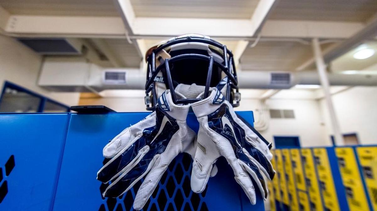 
Some prep football tools of the trade include helmets for all and gloves for some. 
