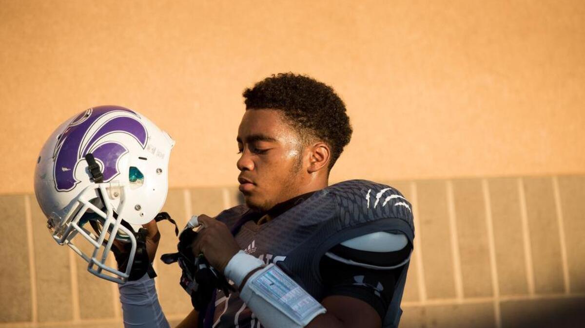 
Franklin Wildcats' Joe Guillory (50) heads out for pregame warmups as the Franklin Wildcats host the Grant Pacers at Cosumnes Oaks High School on Friday, September 25, 2015.
