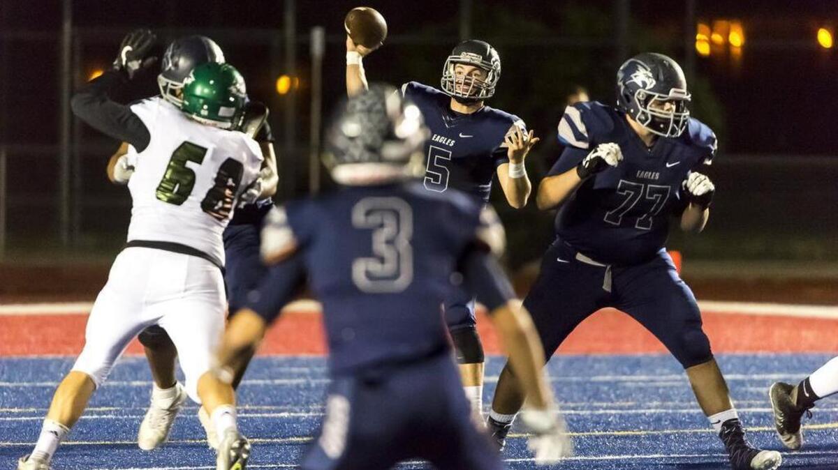 Vista del Lago Eagles Brent Schaeffer (5) passes the ball during the first quarter as Vista del Lago plays El Camino at Folsom High School, Friday, October 28, 2016.