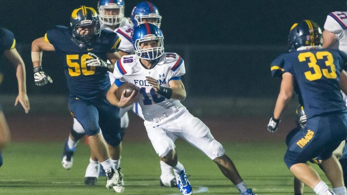 Folsom Bulldogs Jake Jeffrey (18), runs with the ball during the first quarter as the Oak Ridge Trojans host the Folsom Bulldogs, Friday October 30, 2015.