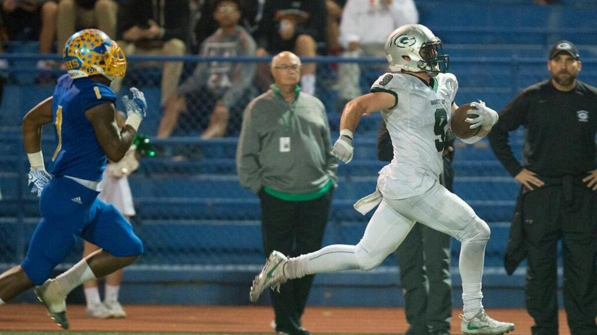 Granite Bay’s Evan Tattersall (9) outruns Pacers Quay Mitchell (1) for a touchdown last season. Tattersall scored two fourth-quarter touchdowns on Friday night to help the Grizzlies beat Whitney.