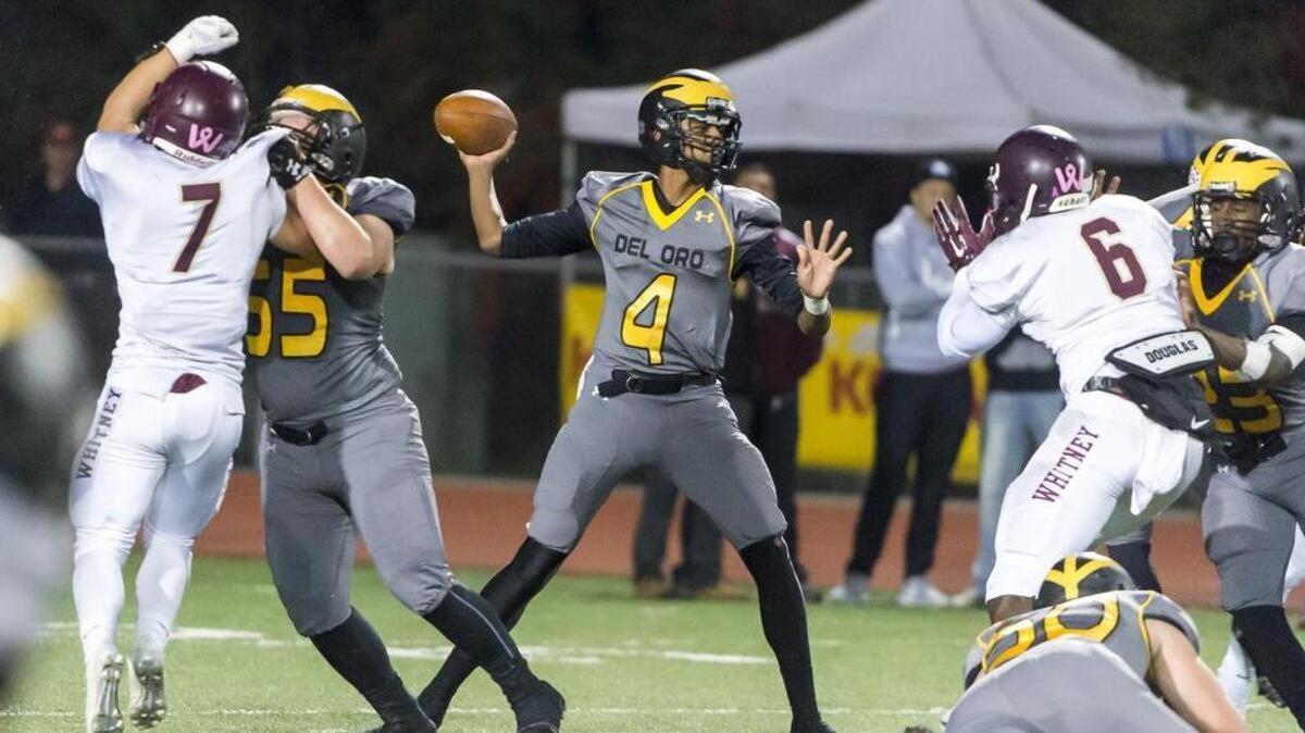 Del Oro Golden Eagles Stone Smartt (4), passes the ball during the first quarter as the Del Oro Golden Eagles host the Whitney Wildcats in the Sac-Joaquin Section/Les Schwab Tires Division II first round playoff game, Friday Nov 13, 2015.