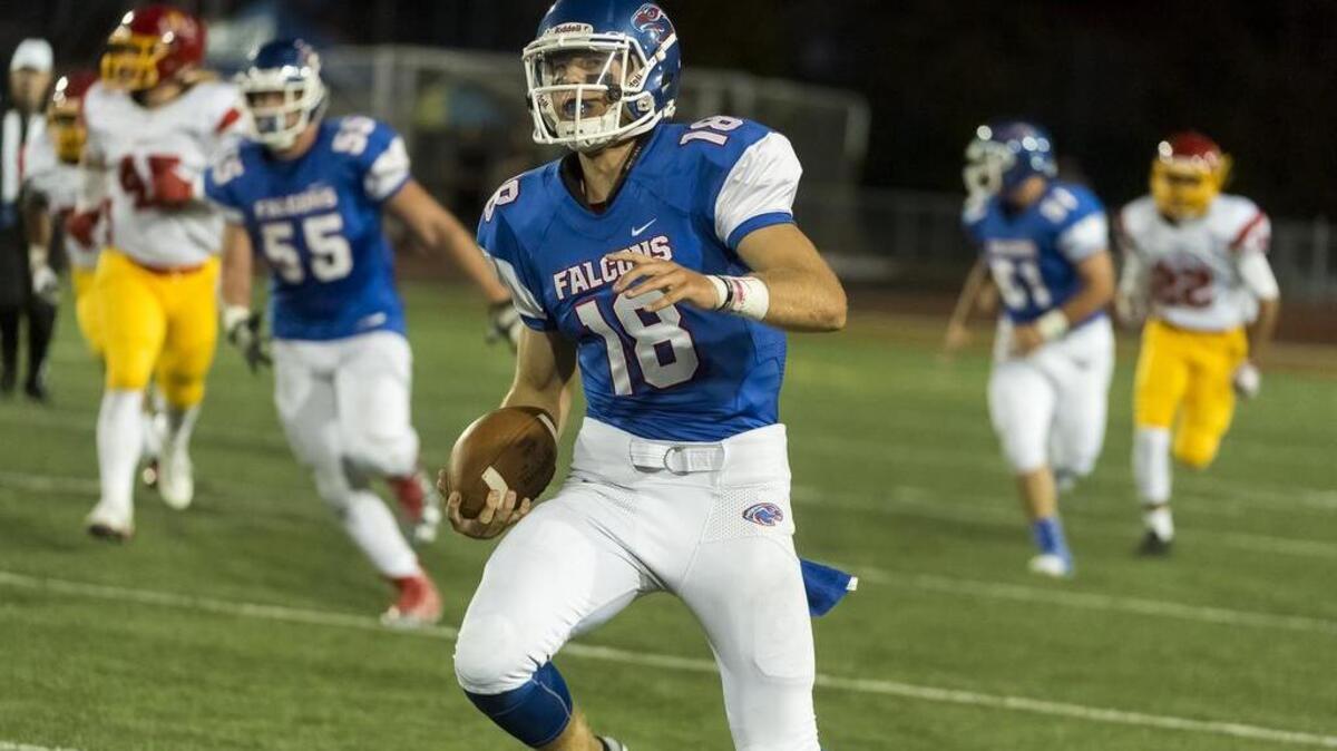 Christian Brothers High School Falcons Tyler Vander Waal (18), runs with the ball during the first quarter of the Holy Bowl between Christian Brothers High School Falcons and Jesuit High School Marauders at Hughes Stadium , Saturday, Sept. 10, 2016.