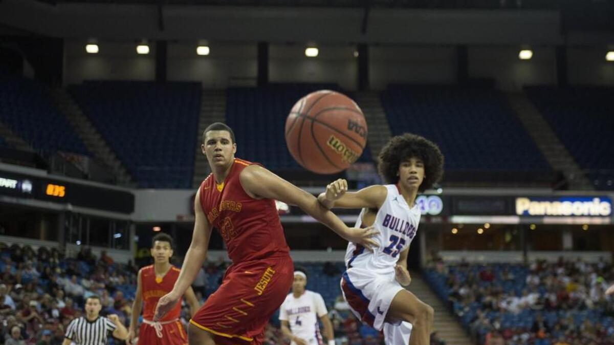 Folsom’s Mason Forbes (25) and Jesuit’s Malik Duffy (32) watch the ball bounce away during the fourth quarter of the 2016 Sac-Joaquin Section Division 1 semifinal playoff game at Sleep Train Arena in Sacramento.