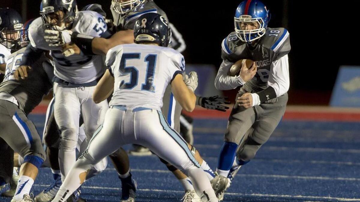 Folsom Bulldogs Jake Jeffery (18), runs with the ball during the first quarter as the Folsom Bulldogs host the Bellarmine College Prep Bells in the CIF NorCal Division I-AA championship football game at Folsom High School, Friday, December 11, 2015.
