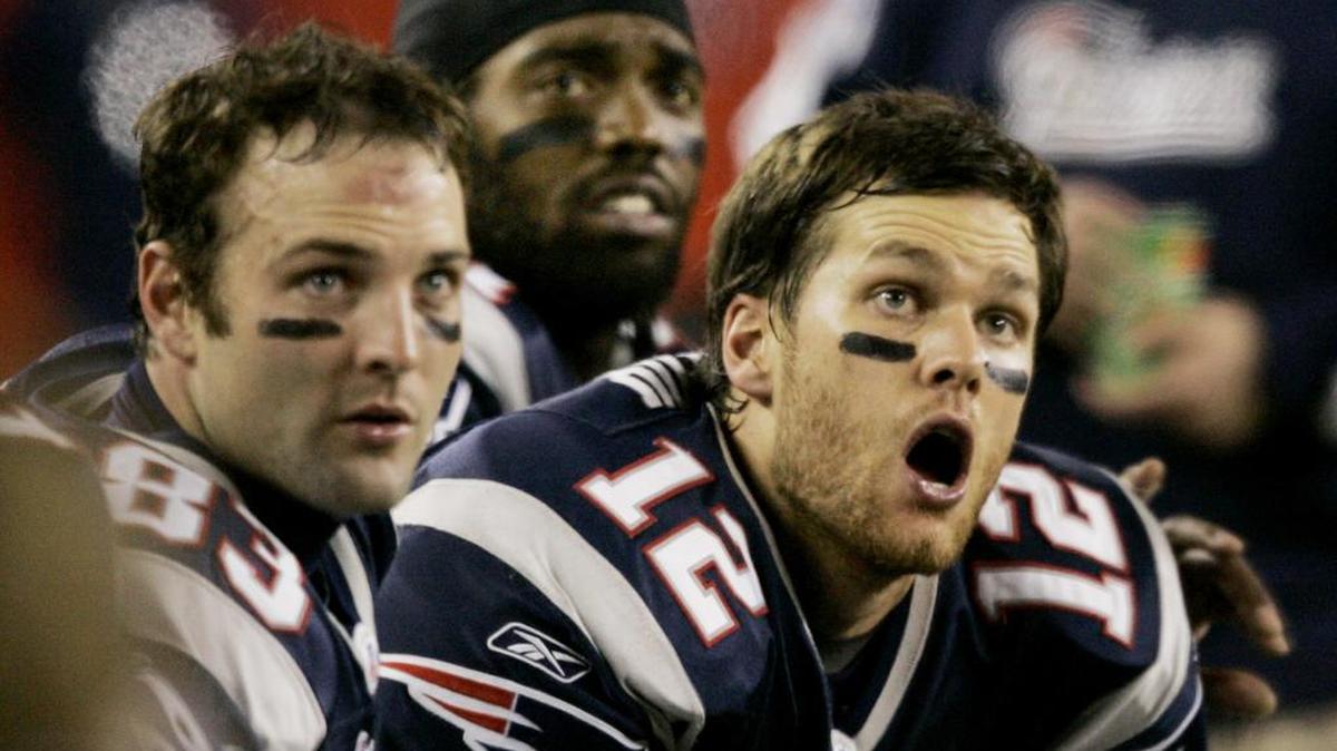 Wes Welker (83) watches the video scoreboard with New England Patriots teammates Tom Brady (12) and Randy Moss, middle, during a game in December 2007. The San Francisco 49ers have hired Welker as their new receivers coach, according to a report.