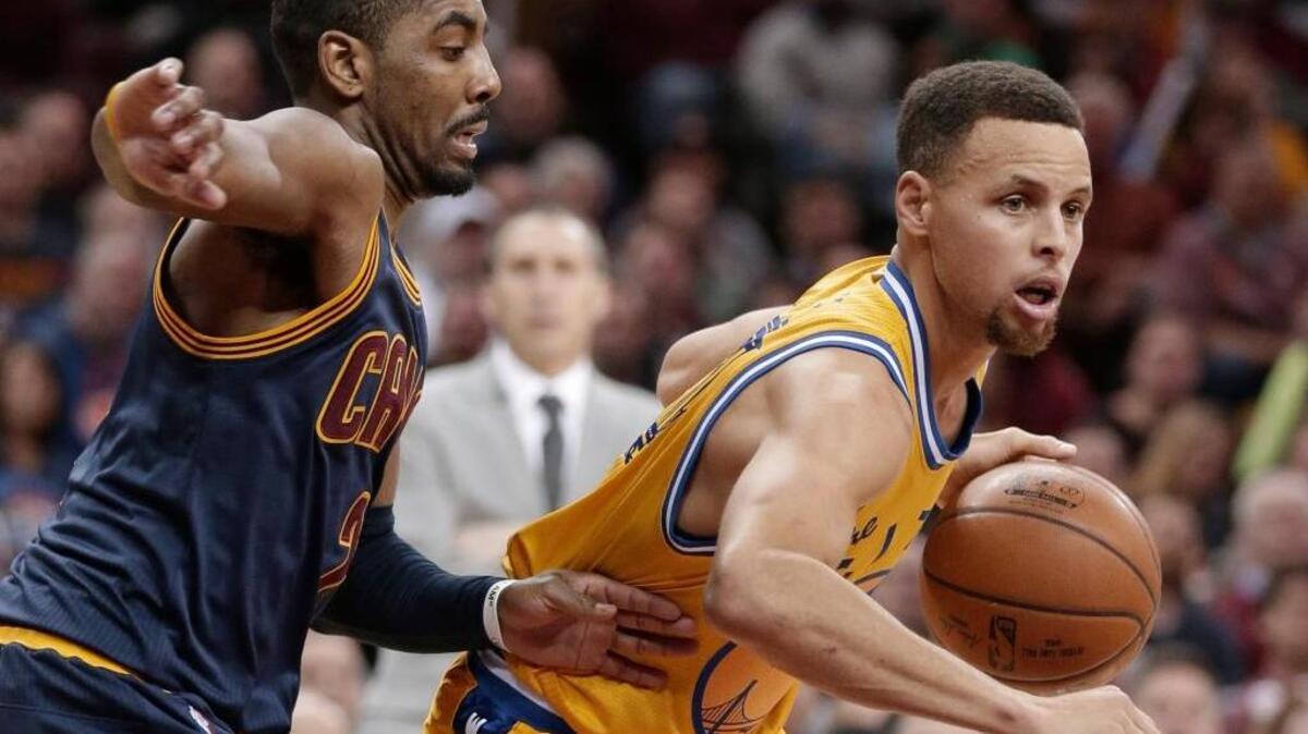 The Golden State Warriors’ Stephen Curry, right, drives past the Cleveland Cavaliers’ Kyrie Irving during an NBA basketball game, Monday, Jan. 18, 2016, in Cleveland. The Warriors won 132-98.