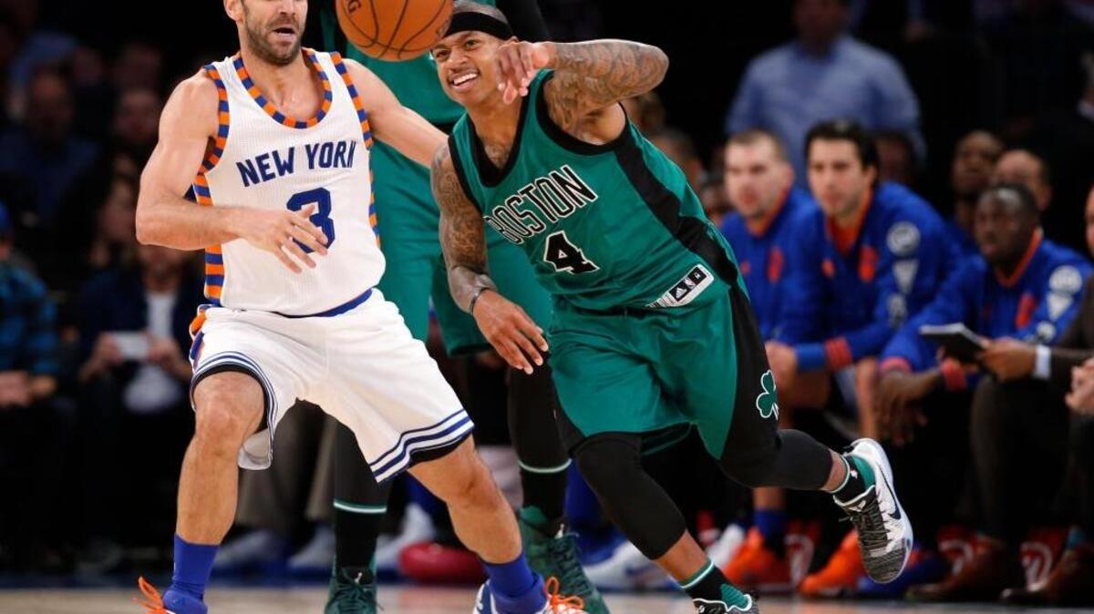 New York Knicks guard Jose Calderon (3) watches as Boston Celtics guard Isaiah Thomas (4) goes after the ball after Calderon stripped it from Thomas during an NBA basketball game at Madison Square Garden in New York, Tuesday, Jan. 12, 2016.