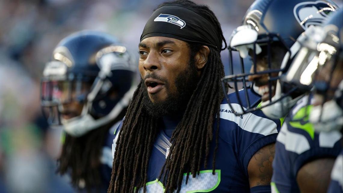 8. Richard Sherman, NFL: Seattle Seahawks cornerback Richard Sherman stands on the sideline before a preseason NFL football game against the Minnesota Vikings on Thursday, Aug. 18, 2016, in Seattle.