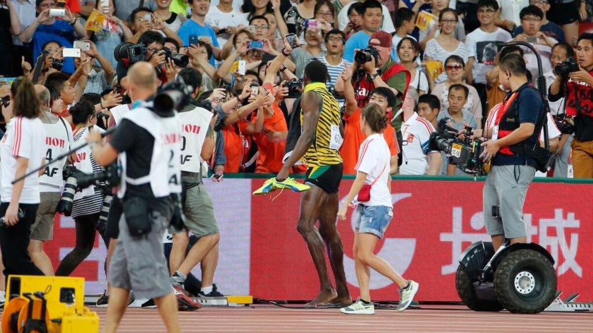 
Jamaica’s Usain Bolt is the fastest man on the planet, but he was no match for a photographer on a Segway, who crashed into the sprinter following the 200-meter final at the World Athletics Championships at the Bird’s Nest stadium in Beijing, Thursday, Aug. 27, 2015. 
