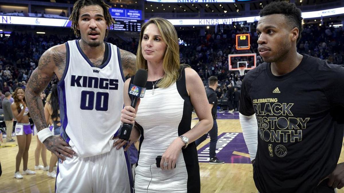 Kings sideline reporter Kayte Christensen prepares to interview Willie Cauley-Stein (00) and Buddy Hield after a victory over Denver on Thursday, Feb. 23, 2017.