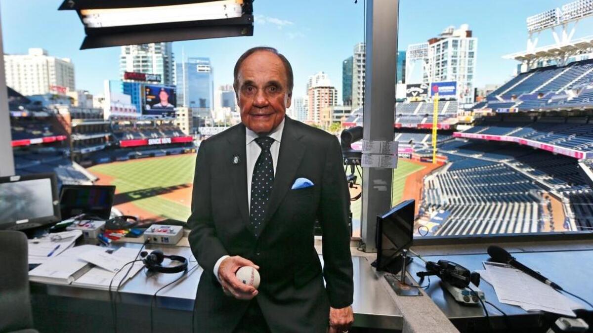 Dick Enberg poses in the booth prior to calling his last San Diego Padres home game Sept. 29, 2016, at Petco Park. Enberg died Thursday in La Jolla. He was 82.