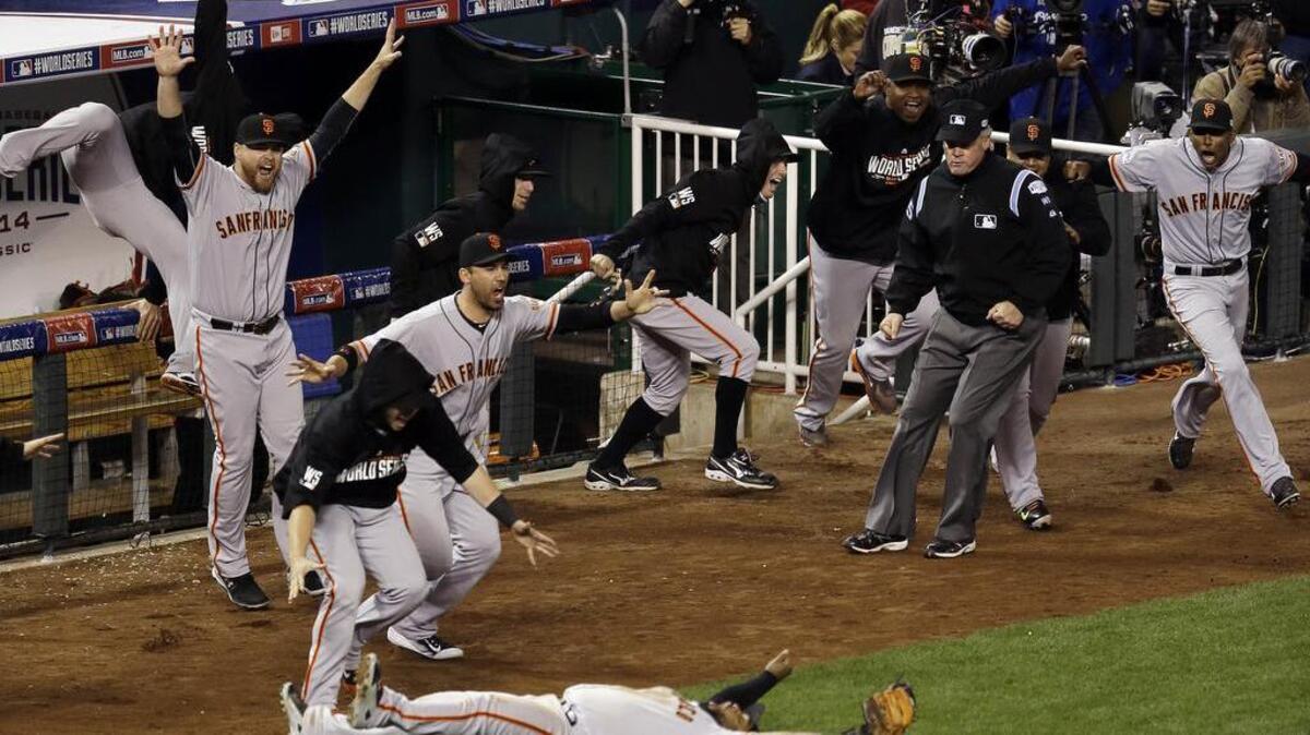 San Francisco Giants third baseman Pablo Sandoval celebrates after catching the final out in the ninth inning of Game 7 of baseball’s World Series against the Kansas City Royals Wednesday, Oct. 29, 2014, in Kansas City, Mo. No one is certain where that final-out ball is now.