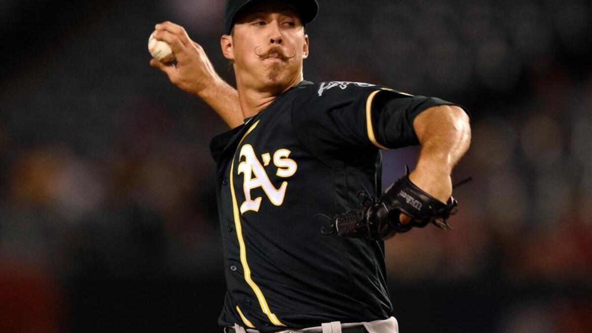 Oakland Athletics starting pitcher Daniel Mengden pitches against the Los Angeles Angels during the first inning of a baseball game in Anaheim, Calif., on Tuesday, Sept. 27, 2016.