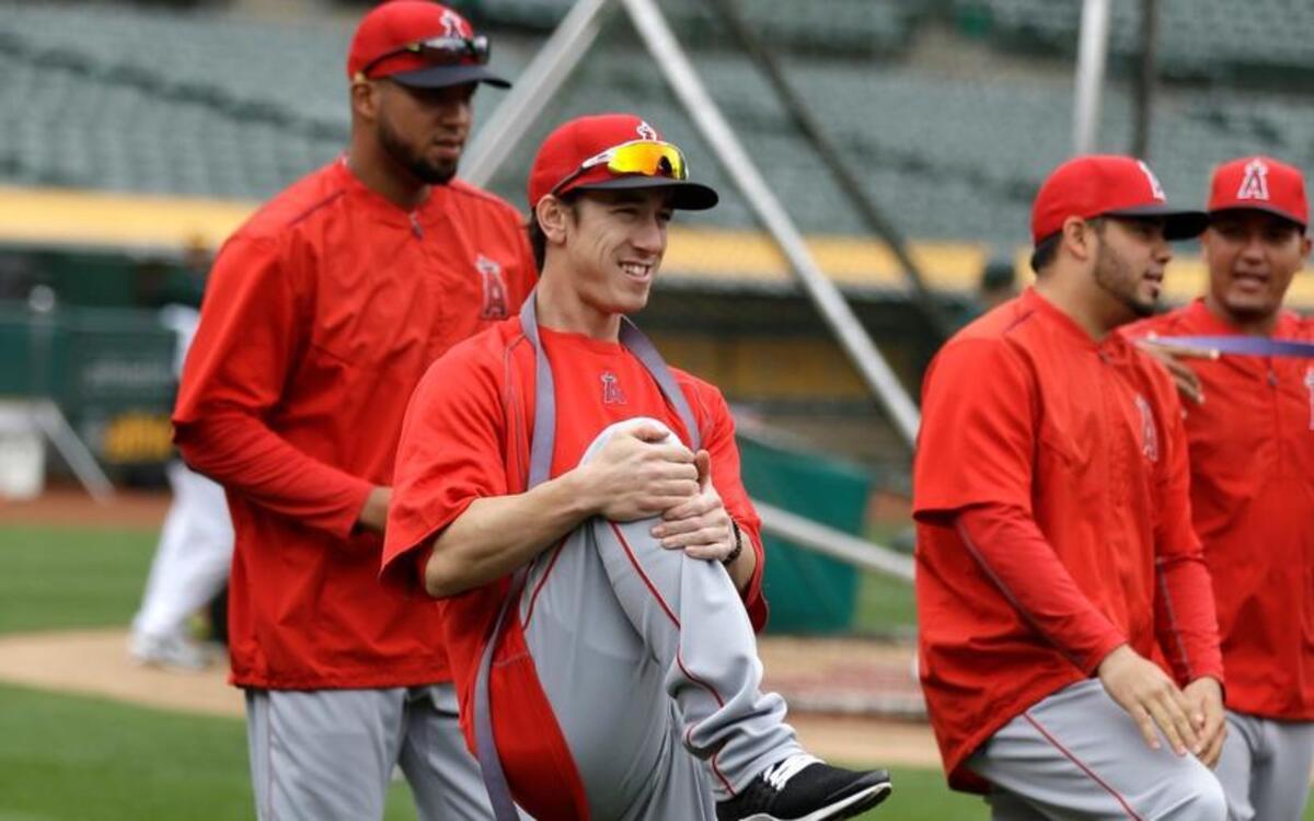 Tim Lincecum stretches with his Angels teammates prior to Friday’s A’-Angels game in Oakland.