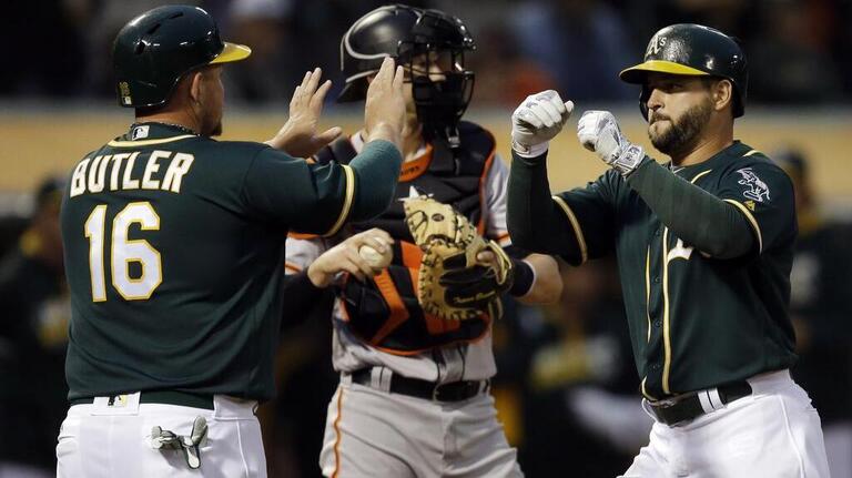 A's pound sloppy Giants 7-1