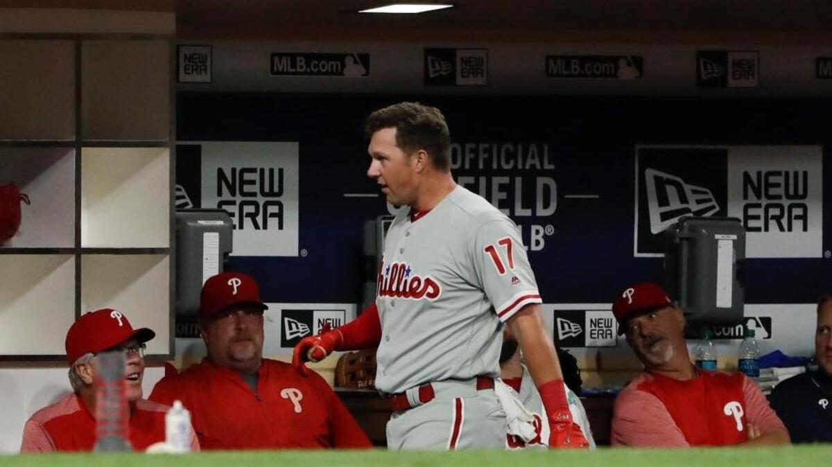 Philadelphia Phillies outfielder Rhys Hoskins is ignored by teammates in the dugout after hitting a home run against the San Diego Padres in the fourth inning Monday in San Diego. He hit another three innings later.