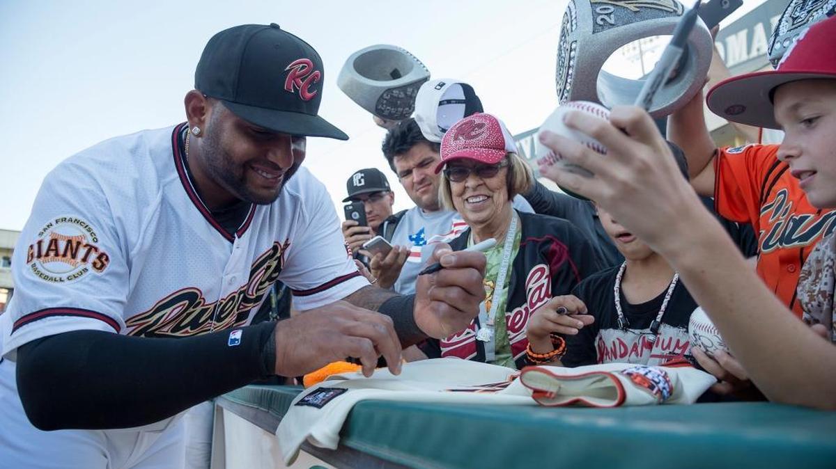 Recently signed San Francisco Giants third baseman Pablo Sandoval signs autographs with fans as he continues his return to the big leagues, playing for the River Cats at Raley Field on Tuesday July 25, 2017 in West Sacramento, Calif.