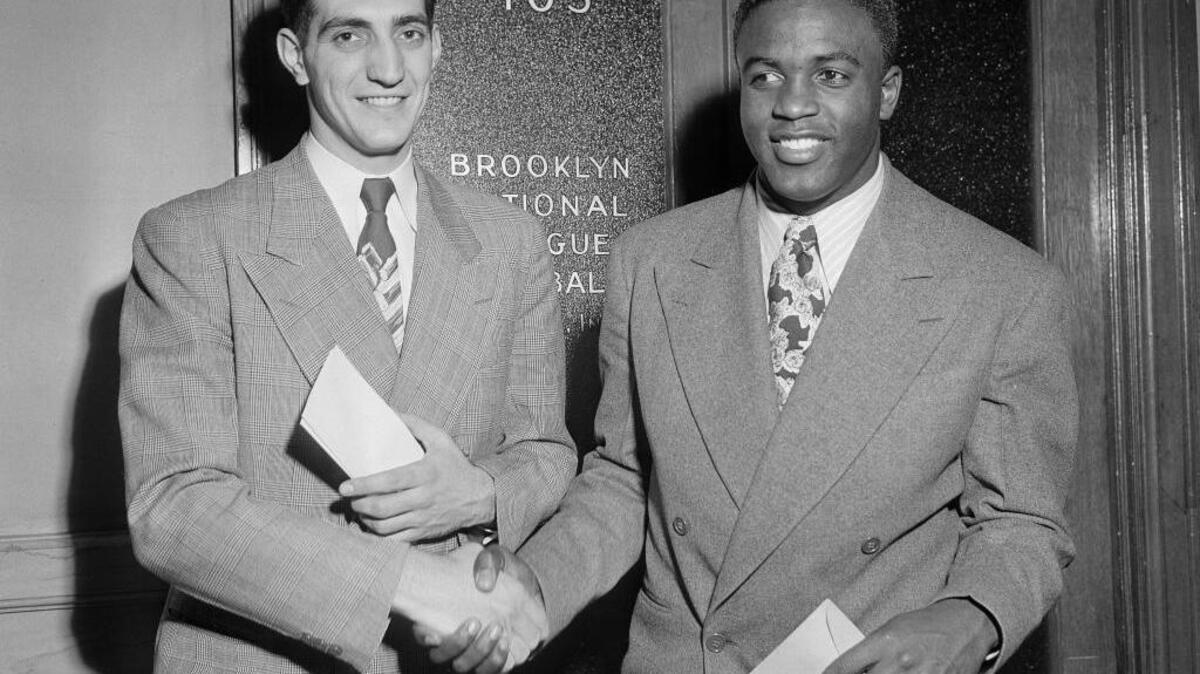 Ralph Branca, left, was among the first to embrace Jackie Robinson after the Hall of Famer broke baseball’s color barrier when he signed with the Dodgers in 1947.