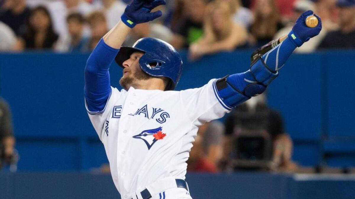 
Toronto Blue Jays’ Josh Donaldson follows through on an RBI double off Cleveland Indians pitcher Trevor Bauer during the second inning Sept. 2 in Toronto.
