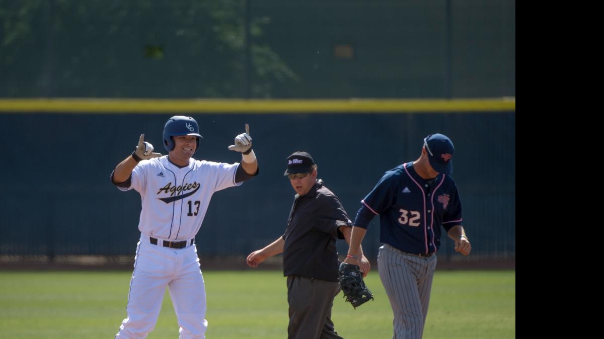 
UC Davis’ Nick Lynch (13) signals toward the Aggie bench after hitting a double in the first inning on Tuesday, March 31, 2015 in the college baseball game between the UC Davis Aggies and Saint Mary's Gaels in Davis.
