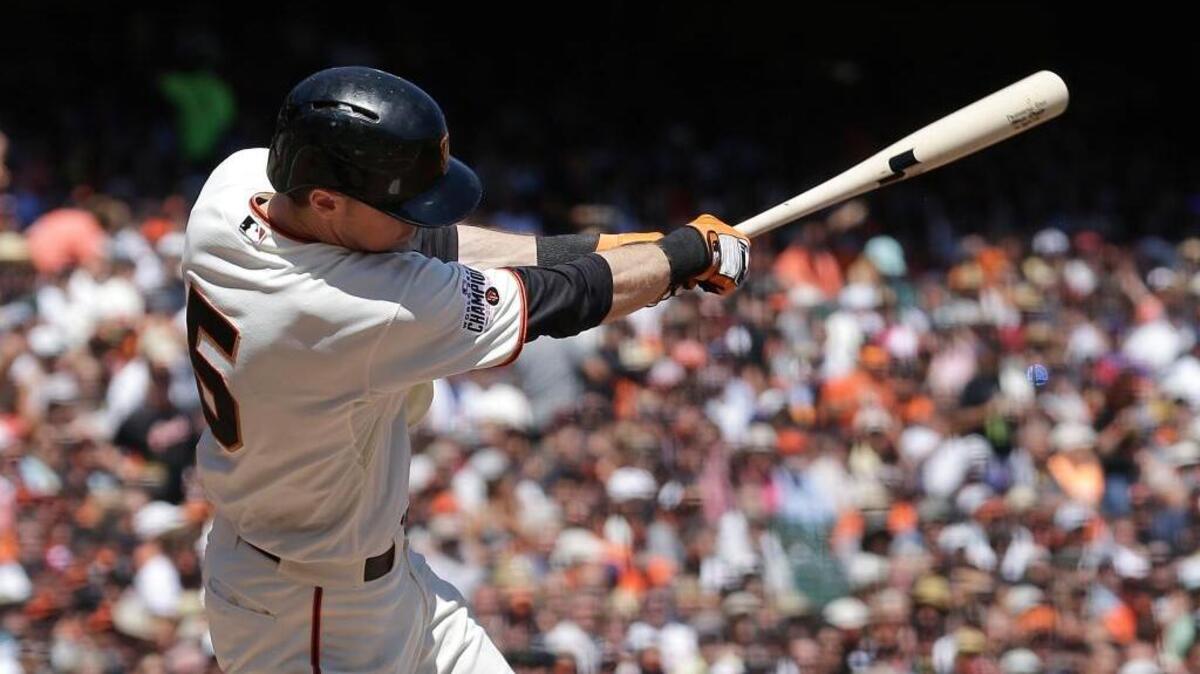 
The Giants’ Matt Duffy hits an RBI-single off Chicago Cubs pitcher Dan Haren during the third inning of a baseball game in San Francisco, Thursday, Aug. 27, 2015. 
