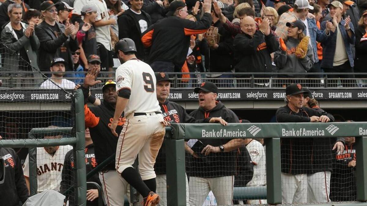 San Francisco Giants first baseman Brandon Belt and shortstop Brandon Crawford enjoyed a productive week at the plate. ... Belt (9) is congratulated after scoring against the Colorado Rockies during the 10th inning of a Major League Baseball game in San Francisco, Saturday, May 7, 2016 in San Francisco.