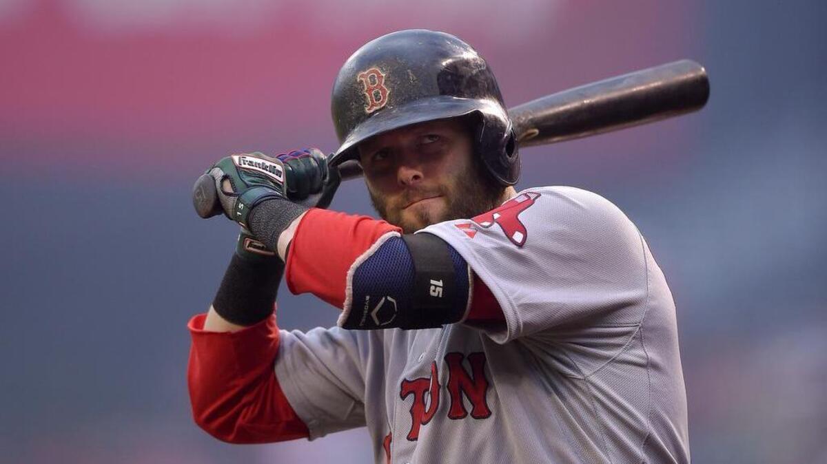 
Boston Red Sox’s Dustin Pedroia warms up before playing against the Los Angeles Angels on July 18.
