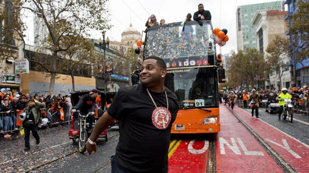 In happier times: San Francisco Giants third baseman Pablo Sandoval celebrates with fans in 2014 as the World Series champions celebrate with a downtown parade.