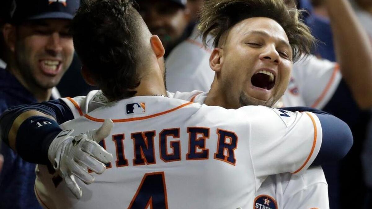 Houston Astros’ Yuli Gurriel is congratulated by George Springer after hitting a home run during the second inning of Game 3 of baseball’s World Series against the Los Angeles Dodgers Friday, Oct. 27, 2017, in Houston.